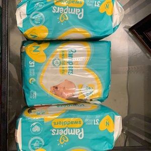 3 packs of (Pampers brand) NEWBORN DIAPERS